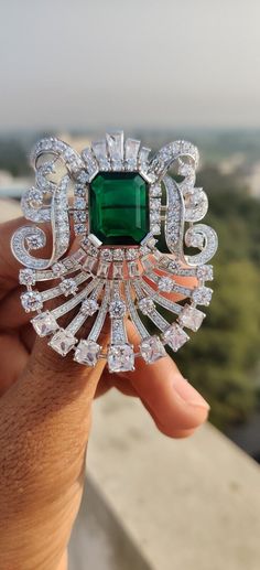 Luxury Brooches With Diamond Accents, Luxury Green Brooch For Formal Occasions, Elegant Green Diamond Brooch, Luxury Diamond Brooches For Evening, Luxury Diamond Brooch For Evening, Luxury Diamond Evening Brooches, Luxury Silver Brooches, Luxury White Gold Evening Brooch, Luxury Evening Gemstone Brooches