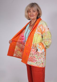 Bright, colourful Kimono Jacket in Kaffe Fassett print cotton fabrics.  Dropped shoulder style, turned back collar/front band. Turned back contrasting sleeve cuffs.  Two roomy  patch pockets. Lined in multi-dyed cotton fabric. Hems bound with cotton fabric.  Size: Small 10 -12 Back length: 71cm    28" One only in this colourway. All my jackets and coats are unique one offs. I am drawn to collecting various fabrics in small quantities. The colours or prints will speak to me as here in the bright, Multicolor Cotton Outerwear For Summer, Multicolor Relaxed Fit Cotton Outerwear, Multicolor Cotton Outerwear With Pockets, Orange Patchwork Outerwear For Spring, Multicolor Cotton Outerwear For Spring, Spring Multicolor Cotton Outerwear, Fitted Multicolor Cotton Outerwear, Speak To Me, Bright Boho