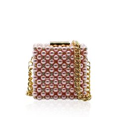 Handcrafted with care in Italy with up to 8 hours of hand work, this clutch is a masterpiece of luxury. This clutch boasts a metal frame available in gold or silver, delicately adorned with Artisan pearls and sparkling crystals, catching the light with every movement.Luxurious leather graces the interior, offering both sophistication and functionality. Material: Metal Frame, Artisan pearls and sparkling crystals, Leather Unlined Height: 10 cm Width: 10 cm Depth: 6 cm Complete with a versatile 80 Crystal Bags, Classic Bags, Hand Work, Sparkling Crystal, Shine Bright, Pink Gold, Pink And Gold, Metal Frame, Jewelry Accessories