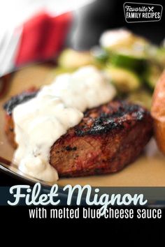 a close up of a plate of food with meat and vegetables on it, the title reads filet migon with melted blue cheese sauce