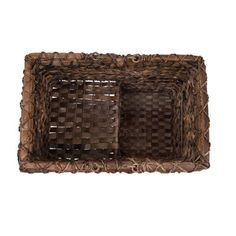 two brown baskets sitting on top of each other