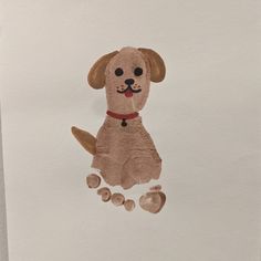 a drawing of a dog on paper with paw prints in the shape of a dog