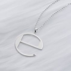 Based off the iconic ℮ symbol, this necklace is made entirely of sterling silver. There is a 1.3mm Diamond set into this near the tip of the e. Very loosely Ecco2k and Drain Gang inspired.  Comes on a 18-20 inch sterling silver chain. Drain Gang, La Pointe, Sterling Silver Chains, Drain, Silver Chain, Jewelry Necklace Pendant, Diamond Necklace, Handmade Items, Jewelry Necklaces