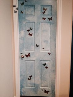 a white door with butterflies on it