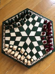 a checkerboard board with chess pieces arranged on it