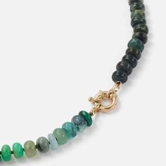 The Encirkled Camo Gemstone Beaded Necklace is the ultimate addition to your neck stack, featuring a 14k spring ring closure perfect for displaying your favorite charms. 8mm assorted gemstones that may include agate, amber, aquamarine, aventurine, cat's eye, chocolate moonstone, chrysoprase, emerald, fluorite, chrysocolla, green onyx, jasper, labradorite, malachite, pyrite, sapphire, smoky quartz, tourmilated quartz 12mm 14k yellow gold spring ring clasp Each piece is unique and may vary slightl Oval Chrysoprase Gemstone Necklaces, Oval Chrysoprase Gemstone Necklace, Oval Jade Gemstone Beads Jewelry, Oval Jade Jewelry With Natural Stones, Elegant Round Amazonite Necklace, Elegant Faceted Chrysoprase Jewelry, Yellow Gold Beaded Necklaces With Natural Stones, Elegant Jewelry With Natural Stones And Chrysoprase, Elegant Chrysoprase Jewelry With Natural Stones