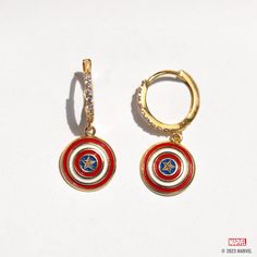 With our Marvel's Captain America Hoops, you can add some Super Hero style to your everyday look. The hoops feature Captain America's iconic shield, with vibrant red, white, and blue enamel detailing that's sure to make a statement. The glimmering stones that line the hoops add an extra level of chicness, making these earrings a true standout. Captain America Jewelry, Avengers Jewelry, Marvel Earrings, Panther Earrings, Avengers Icon, Marvel Jewelry, Wakanda Forever, Marvel Captain America, Necklace Chain Lengths