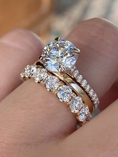 caption:Shown in 14k yellow gold, with 2ct round center diamond option Stackable Bands With Engagement Ring, Moissanite Engagement Ring 4ct, 2.25 Carat Round Engagement Ring, Two Tone Wedding Rings Women, Ring Finger Stack, Round Wedding Ring Sets Stacked, Unique Wedding Bands For Round Diamond, Curved Wedding Ring Stack, 10 Year Engagement Ring Upgrade