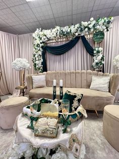 a living room filled with furniture and flowers