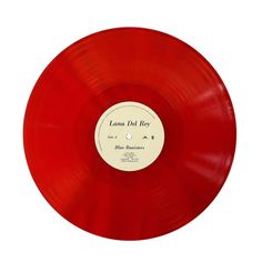 a red vinyl record with the label lamaa del poo on it's side