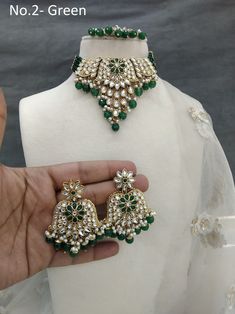 *Light Weight kundan choker necklace set. *Beautiful & Light in weight. *Pendent length- 2.5 inches( included pearl drops) *Pendent width- 4 inches *Earrings length: 2.3 inches  (with drops)   *Earrings diameter: 1.3 inches Green Kundan Necklace For Festive Occasions, Green Kundan Necklace For Party And Festivals, Green Kundan Necklace For Festivals And Parties, Green Chandbali Kundan Necklace In Temple Jewelry Style, Green Kundan Necklace For Party, Green Chandbali Kundan Necklace Gift, Green Kundan Emerald Necklace For Gift, Green Bollywood Kundan Necklace For Festivals, Bollywood Green Chandbali Kundan Necklace