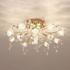 a chandelier hanging from the ceiling in a room