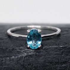 This ring is made from beautiful teal blue Kyanite with nice clarity. It is size 6.5. The oval faceted gemstone is 5 mm x 7 mm and is prong set in sterling silver.  Your sterling silver ring will be shipped gift boxed with a descriptive jewelry card listing gemstones and metal used. Elegant Apatite Rings As A Gift, Elegant Apatite Rings For Gifts, Oval Apatite Gemstone Ring, Faceted Oval Topaz Ring Gift, Classic Oval Faceted Topaz Ring, Oval Turquoise Sapphire Ring As A Gift, Faceted Oval Topaz Ring In Sterling Silver, Oval Faceted Topaz Ring In Sterling Silver, Turquoise Oval Topaz Promise Ring