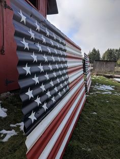 an american flag painted on the side of a building