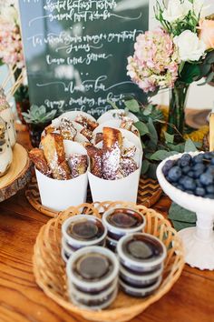 desserts and pastries are displayed on the table