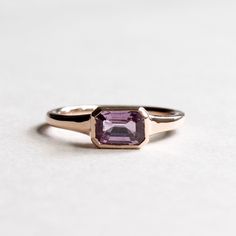 East west pink sapphire solid signet ring Metal: 14K Rose Gold Stone: Pink Sapphire Stone Size: 7mm x 5mm Stone Weight: 0.95 carat Dimension: 1.75 mm band width All of our jewelry will arrive in custom packaging ready for gift giving. LEAD TIME: Ready to ship FOLLOW US ON: Instagram: @roseandchoc Facebook: /Roseandchoc Pinterest: @Roseandchoc Rose Gold 14k Gemstone Signet Ring, Rose Gold Signet Ring With Gemstone, Rose Gold Gemstone Signet Ring, Fine Jewelry Rose Gold Signet Ring With Gemstone, Classic Emerald Cut Sapphire Ring In Rose Gold, Rose Gold Signet Ring With Gemstone For Anniversary, Classic Emerald-cut Rose Gold Sapphire Ring, Classic Rose Gold Sapphire Ring As Gift, Classic Rose Gold Sapphire Ring Gift