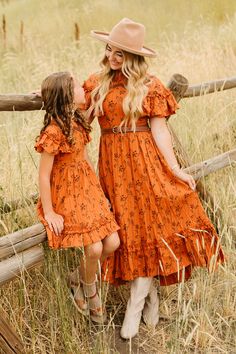 Add a pop of fun to your little's wardrobe with our Mini Shae Dress in Burnt Orange. This playful girl's dress features a unique orange and brown floral print, a high neckline with girly ruffle detailing, and short flutter sleeves. With its midi-length skirt, pockets, and hidden back zipper, this fully lined 100% cotton dress is both stylish and functional. *Please note: some sizes are marked "slightly imperfect" as the lining is slightly longer than the hem of the dress. The sizes marked are fi Girls Western Dresses, White Bridal Dresses, Brown Floral Print, Skirt Pockets, White Dress Party, Fabulous Fall, Fall Fits, Midi Length Skirts, Toddler Girl Dresses