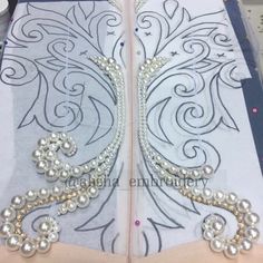 two pieces of fabric with pearls on them