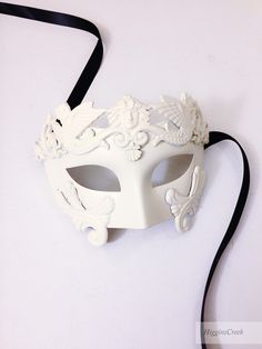 High quality Mask with embellishing is a great addition to any Masquerade Themed party or Mardi Gras. Colors can be customized. Choose custom color option and leave a checkout note with your ideas, we'll be in touch! S H I P P I N G - Processed same day or within 24 hours. 1-2 day guaranteed delivery services offered, add items to cart and click on shipping tab for rates. Pls leave a check out note with your need date & contact number (especially for expedited and custom orders) Msg for deli White Formal Masquerade Mask For Carnival, White Venetian Mask For Costume Party, Venetian White Mask For Costume Party, White Venetian Masquerade Mask For Wedding, White Venetian Masquerade Mask For Costume Party, White Venetian Masquerade Mask For Halloween, Venetian White Masquerade Mask For Halloween, Masquerade Themed Party, Masquerade Masks For Men