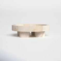 a white wooden table with two circular bases