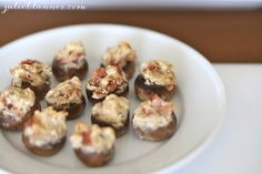 a white plate topped with chocolate covered donuts