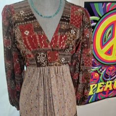 This Dress Is A Genuine Authentic Patchwork Maxi Fresh From The 70s The Colors Are Beautiful It's In Fantastic Condition For Its Era The Sleeve Is Sheer Puff Style Simply Groovy Size Ran Small Then When Made This Dress Will Fit Small Medium The Price Is Firm Vintage Brown Midi Dress For Fall, Vintage Multicolor Midi Dress For Fall, Multicolor Vintage Midi Dress For Fall, Vintage Brown Maxi Dress For Fall, Multicolor Midi Dress For Fall, Retro Patchwork Dress For Fall, Retro Floral Print Maxi Dress For Fall, Vintage Orange Midi Dress For Spring, Vintage Brown Long Sleeve Maxi Dress