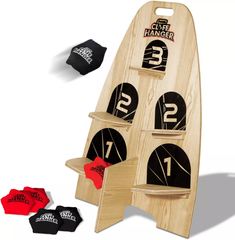 three wooden boards with numbers on them and two red ones in the middle, one black