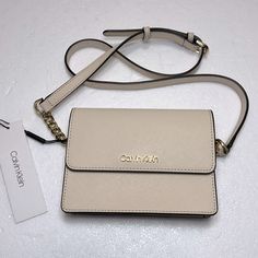 Calvin Klein Crossbody Belt Bagsize For Bag 6.5w X 5h X 1dstrap Adjustable Color Cream Sand Goldnew Never Used Calvin Klein Crossbody Bag, Calvin Klein Purse, Crossbody Belt Bag, Calvin Klein Bags, Calvin Klein Bag, Closet Organizer, My Wife Is, Pretty Bags, Cream And Gold