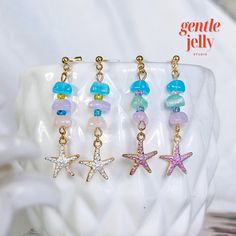 Add a touch of whimsy to your outfit with these adorable pastel stone starfish earrings! 🐚💫 #HandmadeJewelry 💖𝐎𝐕𝐄𝐑𝐕𝐈𝐄𝐖: 🧡 Earrings are made with an assortment of glass beads. 💙 Beads may vary slightly. 💚 This listing is for 1 pair of earrings. 💛 Please note that because the item is handmade/ or due to the lighting, it may differ slightly from those in the photos (please allow a 2% difference). ✨𝐇𝐢𝐠𝐡𝐥𝐢𝐠𝐡𝐭𝐬: ✨ Handmade craftsmanship: Each pair of earrings is meticulously h Ocean-inspired Starfish Charm Earrings, Star Charm Drop Earrings For Beach, Ocean-inspired Drop Earrings With Starfish Charm, Handmade Ocean-inspired Star Earrings, Handmade Star Shaped Jewelry For Vacation, Handmade Star-shaped Jewelry For Vacation, Starfish-shaped Earrings With Star Charm For Gift, Starfish Charm Earrings For Gift, Starfish Charm Earrings Gift