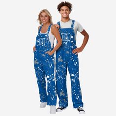 Show your team spirit in these stylish and comfortable Duke Blue Devils Women's Paint Splatter Bib Overalls. With their all-over team-colored design and bold team logo display, these overalls are the perfect way to show your support for the Duke Blue Devils while reminding everyone that your fandom is a masterpiece that even history’s greatest artists would bask in the glory of. The bib pocket is perfect for storing your phone, makeup, jewelry, skincare products, fragrances, or other essentials, Duke Blue Devils, Logo Display, Blue Devil, One Piece Pajamas, Bib Overalls, The Glory, Paint Splatter, Woman Painting, Team Spirit