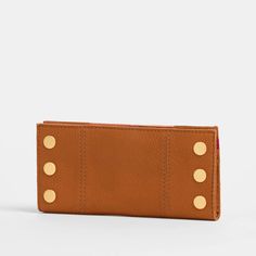 You can't cruise through DTLA without the 110 North. That's why we named our essential folding wallet after LA's fan-favorite freeway. This organizer's dream features 10 credit card slots, a transparent ID pocket, zippered pocket and two drop pockets to hold cash. Creativity and wearability collide in a true masterpiece: Meet our new Artist Tape collection. Our design team accented warm, saturated brown leather with a striking duo of crisp pink stripes. Meticulously straight, as if brought to li Brushed Gold Hardware, Gold Wallet, Heeled Mules Sandals, Lunch Tote, Shoe Gifts, Fold Wallet, Cuff Earrings, Everyday Bag, Leather Care