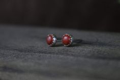 CERISE Earrings - 5mm Round Red Jasper Sterling Silver Minimal Stud Earrings, Every Day Earrings by Turner Duncan Jewelry Designs. 5mm round red jasper cabochons are set in serrated bezel cups and paired with sterling silver ear studs and push on backs. Approximately 5mm round. Jasper is an opaque chalcedony that comes in a wide variety of colors. The term "jasper" itself comes from the Greek work iaspi, meaning "spotted stone." Unlike most jasper which is a heavily banded variety of chalcedony, Minimalist Red Round Earrings, Red Sterling Silver Earrings For Everyday, Dainty Red Earrings For Everyday, Minimal Stud Earrings, Minimal Earrings Studs, Red Jasper, Ear Studs, Jewelry Designs, Sterling Silver Jewelry