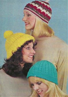 three women wearing knitted hats and sweaters