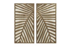 two wooden panels with palm leaves cut out on the sides, one is white and the other is brown