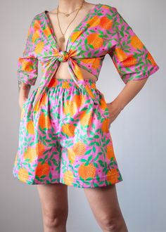 Get ready to deliver some serious vitamin C vibes with our orange garden print! Now available as a pair of shorts or as the most magical, bold and colourful two-piece set for a head to toe tropical outfit that won't go unnoticed! (Top / Shorts sold separately) -High-rise elastic waist -Pockets -Orange Garden print -Comfy wide leg cut -Part of a coord set // Matching top: https://www.etsy.com/listing/711016750/orange-garden-print-organic-cotton-wrap?ref=shop_home_active_45&frs=1&crt=1 -Organic Co Summer Printed Loungewear Shorts, Multicolor Printed Shorts For Loungewear, Multicolor Printed Loungewear Shorts, Summer Orange Shorts With Built-in Shorts, Summer High-waisted Printed Shorts, High-waisted Orange Shorts For Vacation, Orange Shorts With Elastic Waistband For Summer, Spring Printed Shorts For Loungewear, Orange Beachwear Shorts For Spring