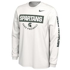 The Men's Nike White Michigan State Spartans 2023 Fan Long Sleeve T-shirt is the perfect way to show unwavering support for the Michigan State Spartans. Crafted from soft, durable cotton, this long-sleeve tee boasts bold graphics that proudly display your team spirit. Whether cheering from the stands or showcasing your support, this shirt is a must-have for any Michigan State Spartans fan. Material: 100% Cotton Crew neck Machine wash, tumble dry low Imported Officially licensed Long sleeve Scree Moisture-wicking Crew Neck Top For Fans, Nike Long Sleeve Fan Gear Top, Moisture-wicking Crew Neck Fan Apparel Top, Nike Long Sleeve Tops Team Spirit, Nike Long Sleeve Tops With Team Spirit, Nike Long Sleeve Tops For Team Spirit, Nike Crew Neck Tops For College, Nike Long Sleeve Tops For Sports Events, White Long Sleeve Tops For Fan Gear