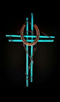 a cross that has some barbed wire around it