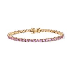 Enhance your jewelry collection with the captivating beauty of our Pink Sapphire Tennis Bracelet. Adorned with vivid pink gemstones, this exquisite piece radiates elegance and charm. Available in 14K Yellow Gold and White Gold Carat weights are reflective of a 7in bracelet. Shorter lengths will have lower carat weights that those listed. Gemstones are natural, therefore colors may vary Pink Diamond Bracelet As A Gift, Classic Pink Bracelets, Classic Pink Tennis Bracelet With Jubilee Style, Pink Diamond Bracelets For Formal Occasions, Fine Jewelry Bracelets With Round Cut Gemstone, Pink Jubilee Tennis Bracelet In Classic Style, Elegant Rose Gold Bracelet For Formal Occasions, Pink Bangle Bracelet For Formal Occasions, Elegant Pink Bracelet Jewelry