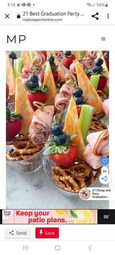 an image of food in small bowls with strawberries and blueberries on top