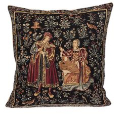 an embroidered pillow with two women on it