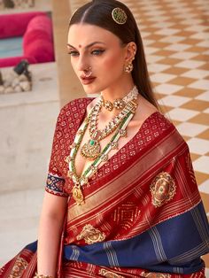 Elevate your ethnic wardrobe with our Elegant Rani Blue Silk Patola Saree, showcasing a timeless foil print design that exudes sophistication and charm. Crafted from luxurious silk, this saree features intricate Patola patterns in a stunning Rani Blue hue, perfect for making a grand statement at any occasion. The saree is complemented by a vibrant red silk blouse, meticulously tailored to enhance the ensemble. The rich red fabric of the blouse contrasts beautifully with the saree’s cool blue tones, creating a striking and elegant look. Ideal for weddings, festivals, and special celebrations, this combination ensures you radiate grace and style. SAREE SPECIFICATIONS:Fabric: Silk Patola Design Foil Print DesignColor: Rani BlueBLOUSE SPECIFICATIONS:Fabric: SilkColour: RedStitching Type: Un-St Saree Drapes, Patola Print, Red Silk Blouse, Patola Saree, Indian Party Wear, Latest Designer Sarees, Indian Sarees Online, Blue Border, Designer Sarees Online