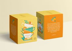 an orange box with a tea cup on it and the packaging is designed to look like a book