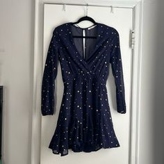 Beautiful Navy Blue With Gold Stars. Never Worn, Doesn’t Fit Me. V-Cut In Front, Keyhole Back, Super Flattering Silhouette! Fitted Blue Star Print Dresses, Blue Spring Dress With Star Print, Blue Star Print Dress For Spring, Spring Blue Dress With Star Print, Blue Dress With Star Print For Spring, Spring Star Print Dress For Date Night, Long Sleeve Star Print Dress For Night Out, Blue Star Print Party Dress, Fitted Star Print Mini Dress For Spring