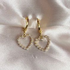 Pearl White Love heart earrings Charm size ; 11mm x 13mm Hoop size 12*12mm 18k GOLD plated Huggies.  They are 18k Gold plated so can be worn everyday and keep their gorgeous gold colour and shine, longer than your standard earring.  Shipping available for International orders * Shipped same/next business day * All earrings come in a gift pouch ✨ * Message me if you have any questions or custom requests 💕 خواتم خطوبة, Money Wallpaper, Burning Desire, Preppy Jewelry, Dope Jewelry, Womens Jewelry, Classy Jewelry, Fancy Jewellery