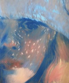 an abstract painting of a woman's face wearing a blue hat