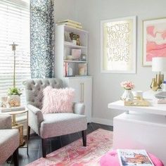 a living room filled with furniture and pictures on the wall above it's desk