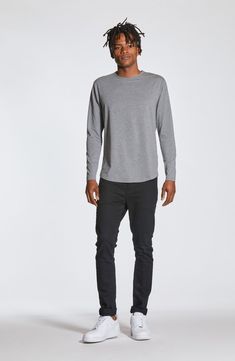 Made from a soft cotton blend, a versatile long-sleeve T-shirt enhanced with a curved hem is an instant closet favorite that looks great alone or layered. Crewneck Long sleeves 62% polyester, 33% cotton, 5% spandex Machine wash, tumble dry Imported Casual Long Sleeve Top With Shirttail Hem, Casual Long Sleeve Top With Shirttail Hem For Layering, Casual Tops With Curved Hem For Fall, Fall T-shirt With Shirttail Hem, Casual Cotton Long Sleeve Top For Layering, Curved Hem Tops For Fall Layering, Casual Tops For Layering With Curved Hem, Basic Cotton Long Sleeve Top For Layering, Long Sleeve T Shirt