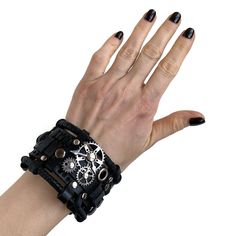 This black gothic leather bracelet was designed in the steampunk and rock style. The bracelet is made of genuine cow leather and decorated with metal parts. Bracelet's width is about 1.97 in (5 cm) Bracelet's length is about 7.9 in (20 cm) It fits the wrist 7.1-8.3 in (18-21 cm) Please measure your wrist to make the correct choice CARE No special care is required. Avoid chemical exposure including perfumery. If you need a custom order please let me know and I will try to do my best to prepare it Black Leather Punk Jewelry, Steampunk Leather Bracelet As A Gift, Steampunk Leather Bracelet Perfect As A Gift, Punk Style Black Leather Bracelet Gift, Black Leather Punk Bracelets, Punk Style Leather Bracelet With Black Band As Gift, Punk Style Leather Bracelet Gift With Black Band, Black Leather Wristband For Festival, Punk Leather Strap Bracelets