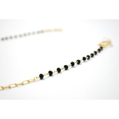 If you're looking for a subtle and classy piece, this chain is the one for you. The elegant gold loops and black spinal stone make for a delicate yet versatile combination. Whether you're going for a casual vibe or a fancy night out, this chain can be styled for any occasion. Chic Beaded Chain Jewelry For Evening, Chic Evening Jewelry With Beaded Chain, Black Metal Jewelry With Chain Strap, Chic Adjustable Chain Glasses Chains For Party, Chic Adjustable Glasses Chains For Party, Chic Adjustable Glasses Chain For Parties, Black Gold-plated Adjustable Chain Jewelry, Elegant Glasses Chains With Chain Strap As Gift, Black Chain Link Jewelry For Everyday