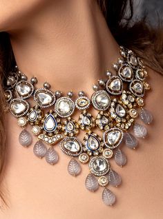 Polki & Carved Stone Bridal Necklace Set - Joules By Radhika Embrace the allure of grace with our 22Kt Gold Plated necklace set. The enchanting Hydro Polkis and elegant grey carved Agates create a mesmerizing symphony of beauty. Perfect for brides seeking sophistication on their wedding day. Shine bright, creating cherished memories as you celebrate your love story with this exquisite set! SET INCLUDES: Necklace and Earrings Details: Handcrafted with ❤️ Metal: Brass Product Type: Necklace Stone: Luxury Traditional Bridal Necklace With Mirror Work, Luxury Silver Kundan Necklace With Peacock Design, Luxury Temple Jewelry Bridal Necklace With Mirror Work, Luxury Bridal Necklace For Puja With Intricate Design, Luxury Multicolor Stone Work Bridal Necklace, Luxury Kundan Necklace With Intricate Design, Luxury Silver Kundan Tikka, Polki Bridal Set, White Indian Jewelry